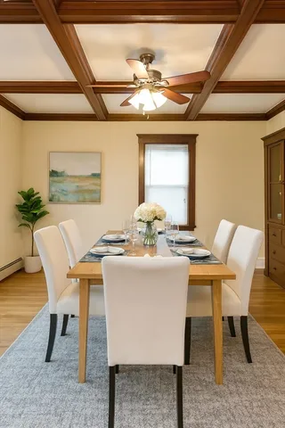 a view of a dining room with furniture and chandelier