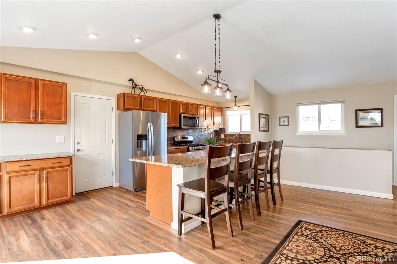 8678 Lariat Loop Elizabeth, CO 80107 - Photo 16 of 50 a view of a kitchen and dining room