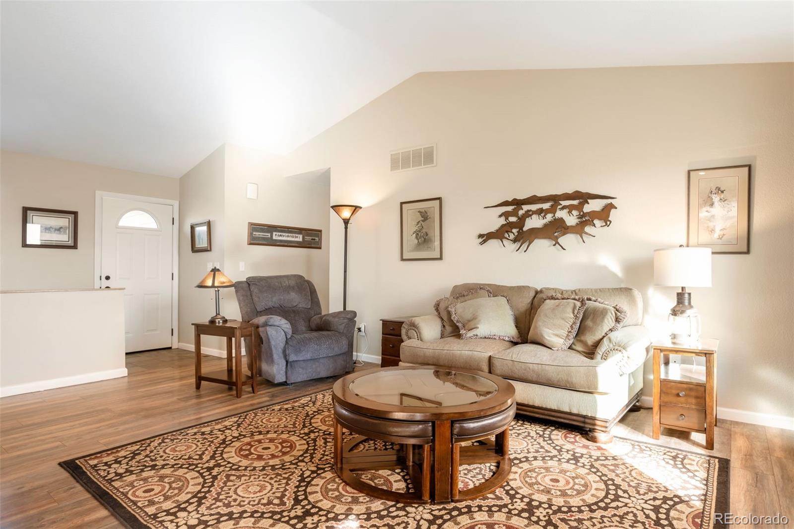 8678 Lariat Loop Elizabeth, CO 80107 - Photo 17 of 50 a living room with furniture and a rug