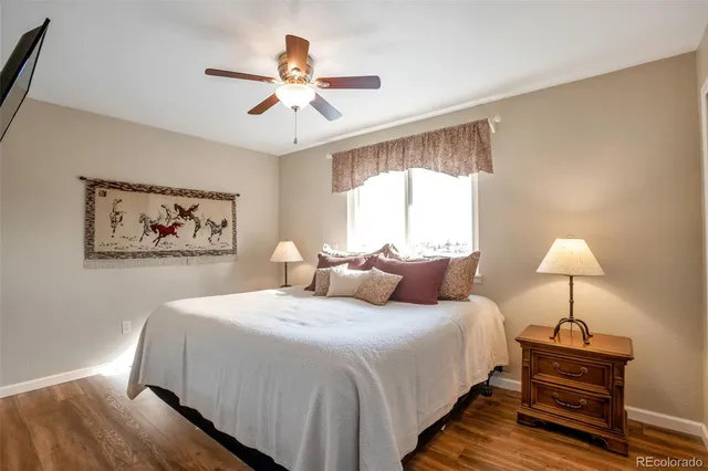 a bedroom with bed and a chandelier