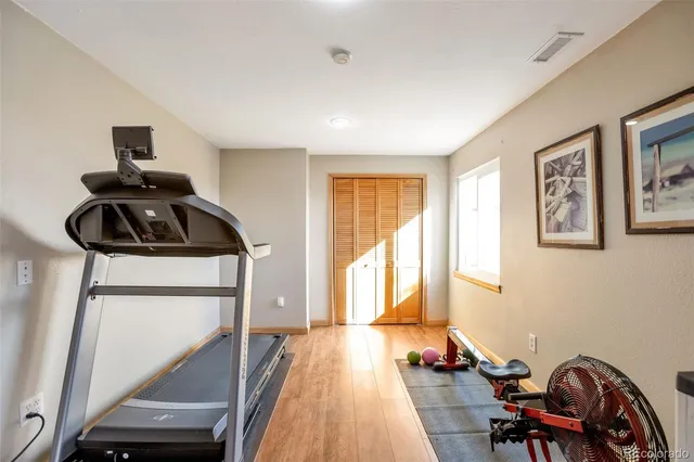 a view of workspace with furniture and staircase