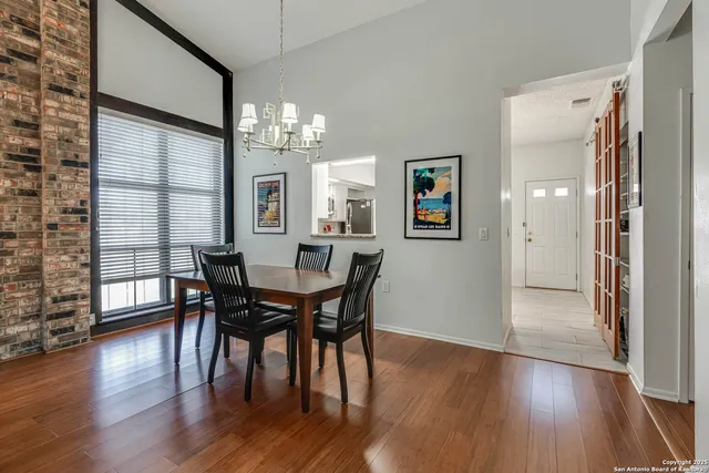 a view of a dining room with furniture window and wooden floor