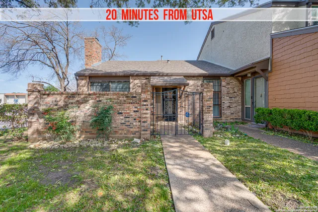 a front view of a building with garden