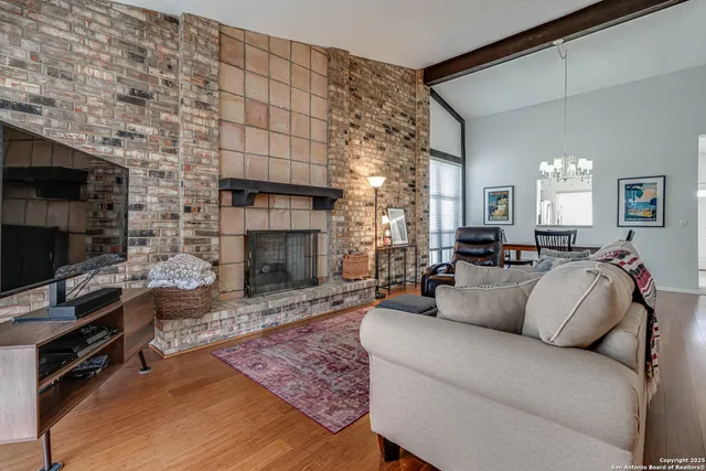 a living room with furniture and a fireplace