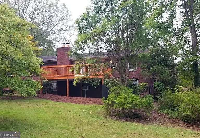 110 South Homewood Drive Athens, GA 30606 - Photo 19 of 21 a front view of a house with a yard