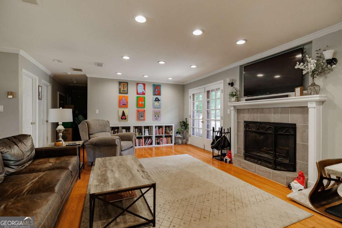 110 South Homewood Drive Athens, GA 30606 - Photo 5 of 21 a living room with furniture and a fireplace