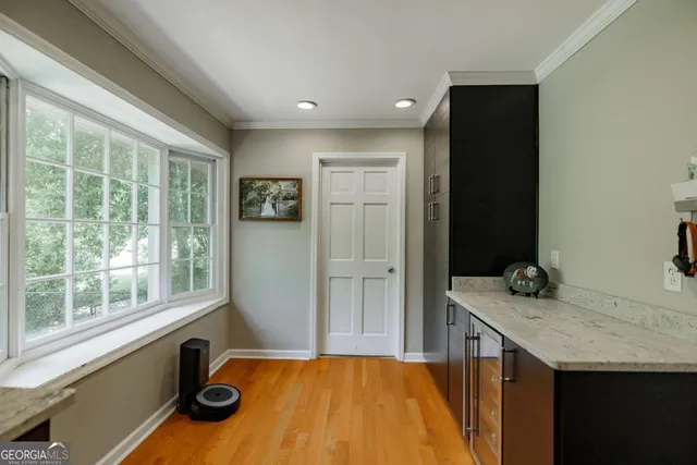 a kitchen with a sink a stove and a refrigerator