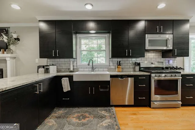 a kitchen with a sink and a stove