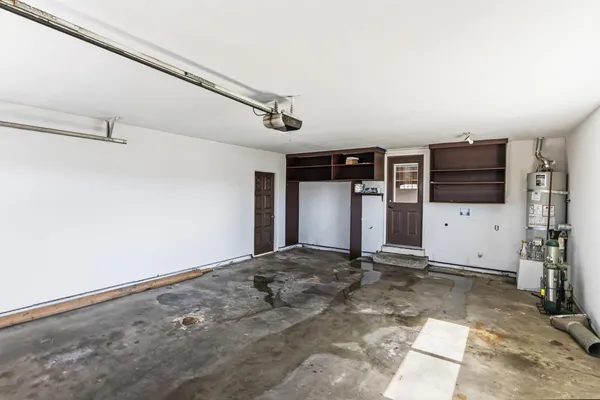 a kitchen with a sink and a refrigerator