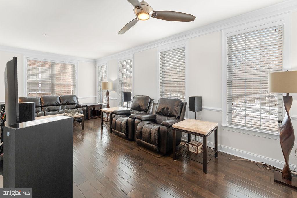 7608 Elmcrest Road Hanover, MD 21076 - Photo 13 of 41 a living room with furniture wooden floor and a window