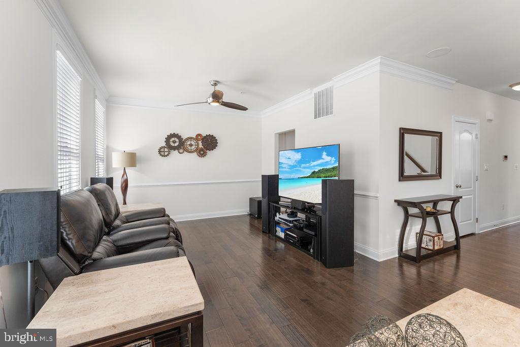 7608 Elmcrest Road Hanover, MD 21076 - Photo 15 of 41 a living room with furniture and wooden floor