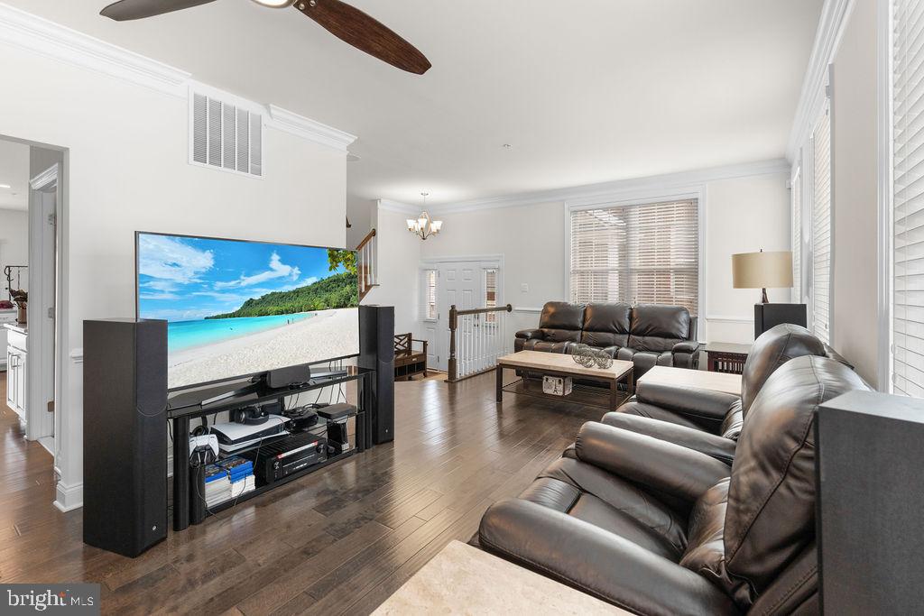 7608 Elmcrest Road Hanover, MD 21076 - Photo 16 of 41 a living room with furniture and a flat screen tv