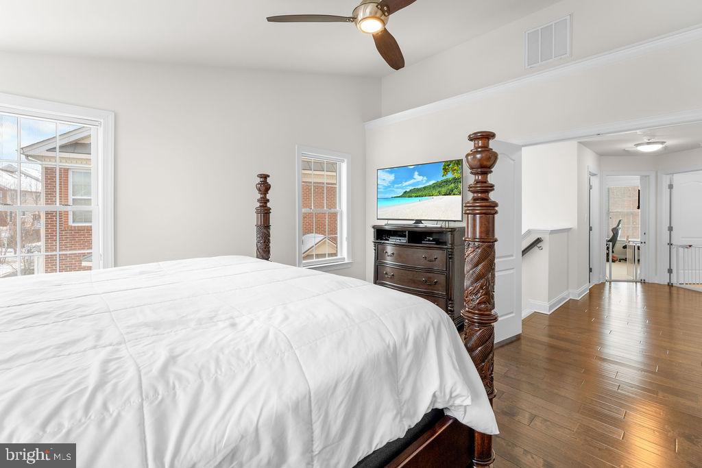 7608 Elmcrest Road Hanover, MD 21076 - Photo 19 of 41 a spacious bedroom with a bed and a flat screen tv