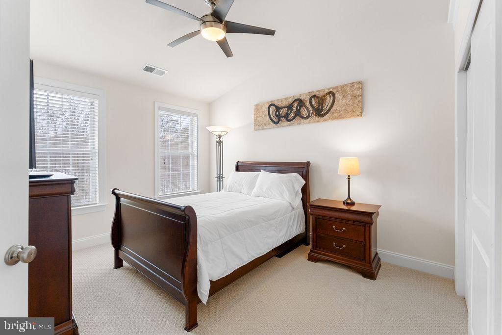 7608 Elmcrest Road Hanover, MD 21076 - Photo 27 of 41 a spacious bedroom with a bed and a window