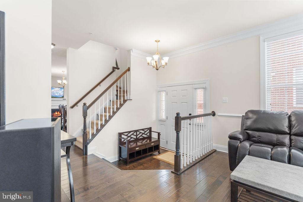 7608 Elmcrest Road Hanover, MD 21076 - Photo 10 of 41 a living room with furniture and stairs
