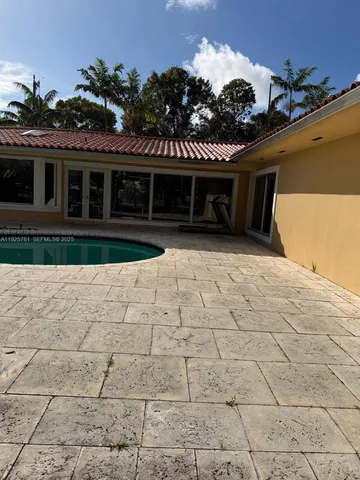 a view of a swimming pool and outdoor space