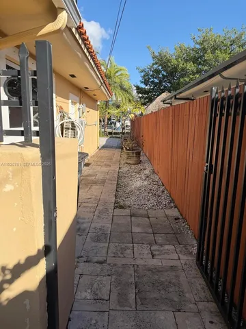 a view of a pathway with a backyard