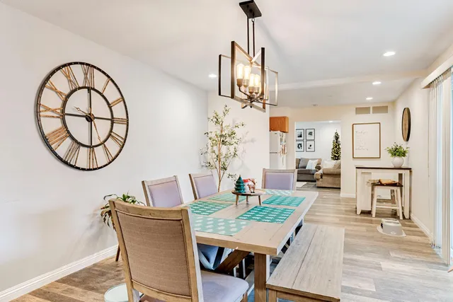 a view of a livingroom with furniture and a chandelier