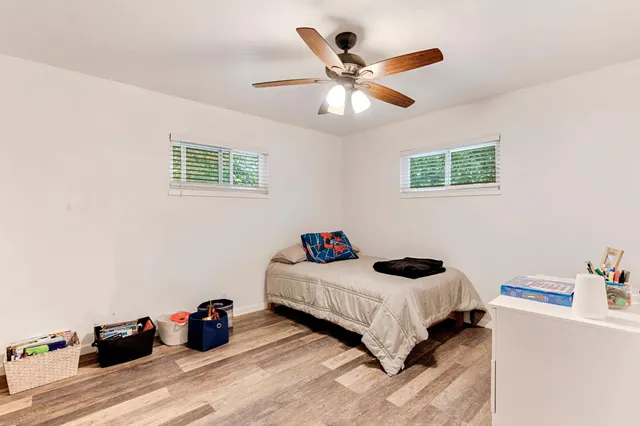 a bedroom with a bed and a dresser