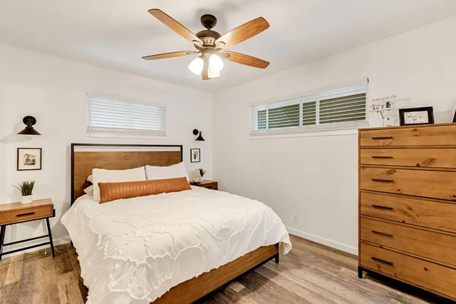 a bedroom with a bed and a dresser