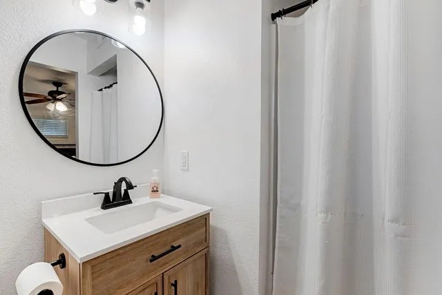 a bathroom with a sink and a mirror