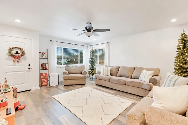 a living room with furniture and a large window