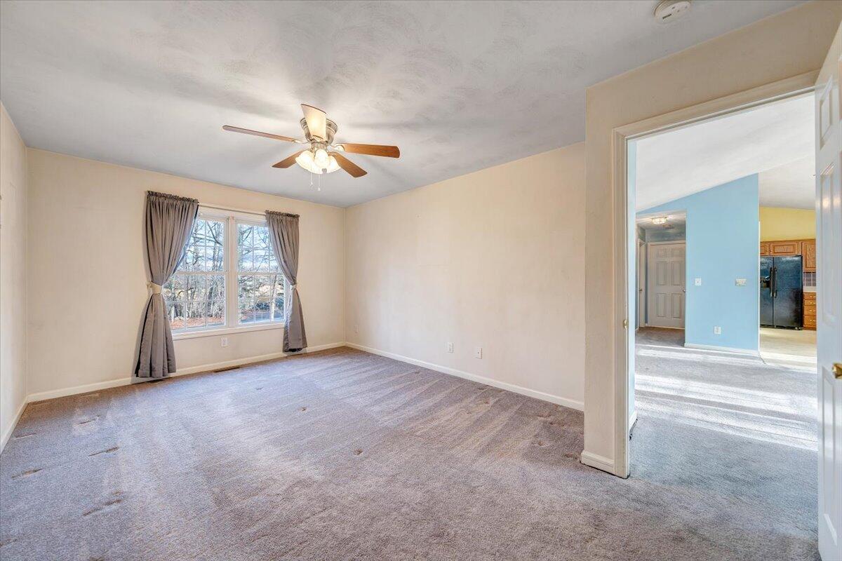 1093 Hales Ford Road Moneta, VA 24121 - Photo 13 of 45 an empty room with windows and fan