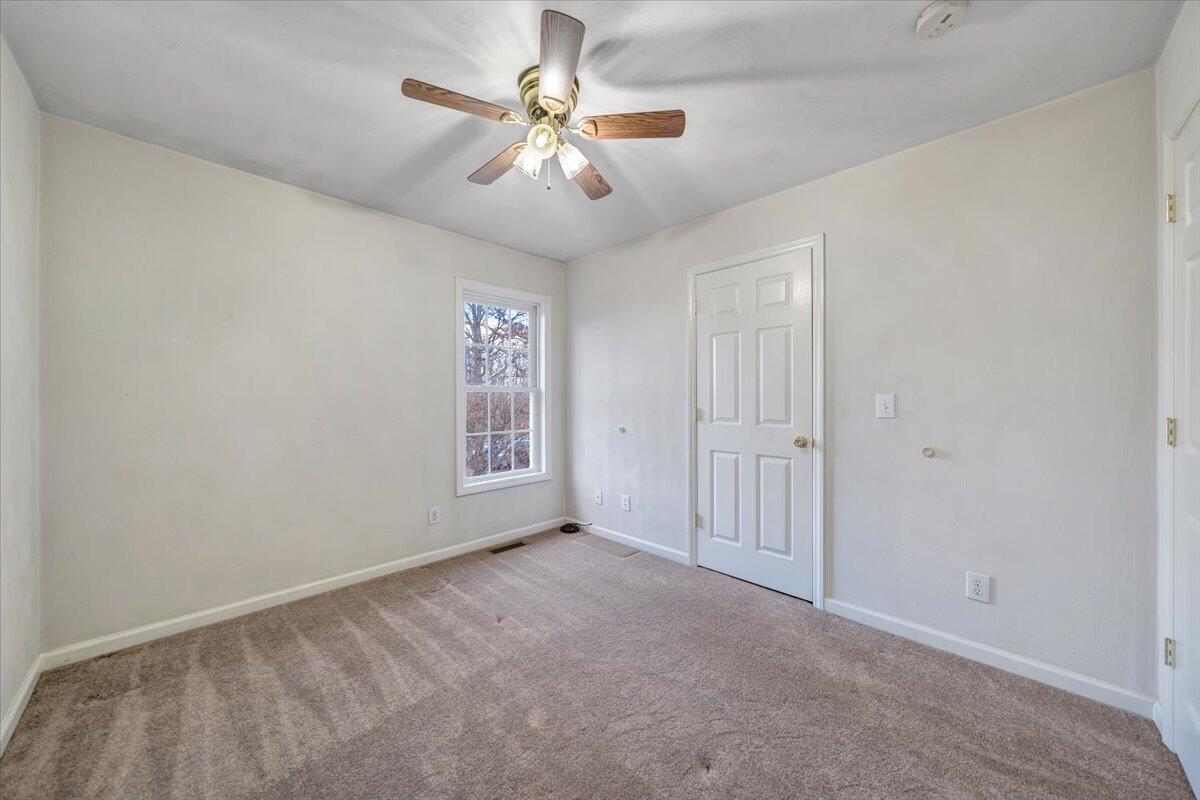 1093 Hales Ford Road Moneta, VA 24121 - Photo 19 of 45 an empty room with windows and fan