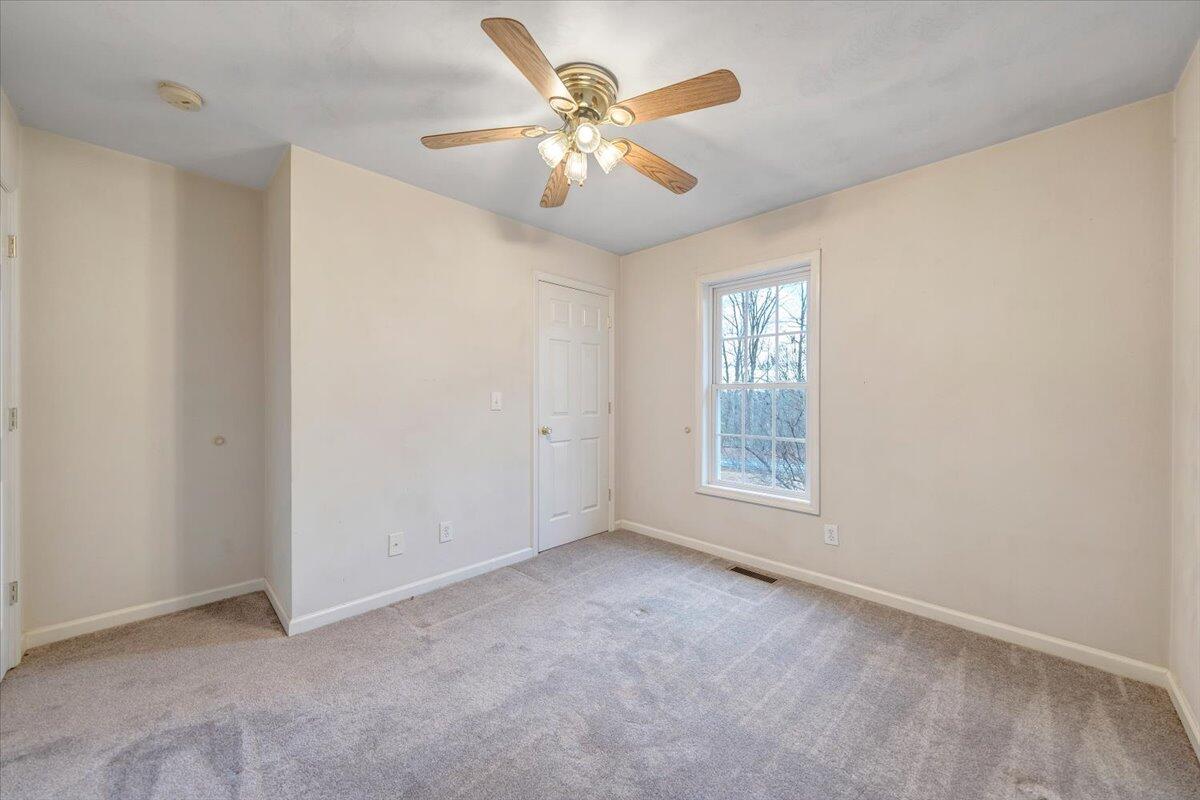 1093 Hales Ford Road Moneta, VA 24121 - Photo 21 of 45 an empty room with windows and fan
