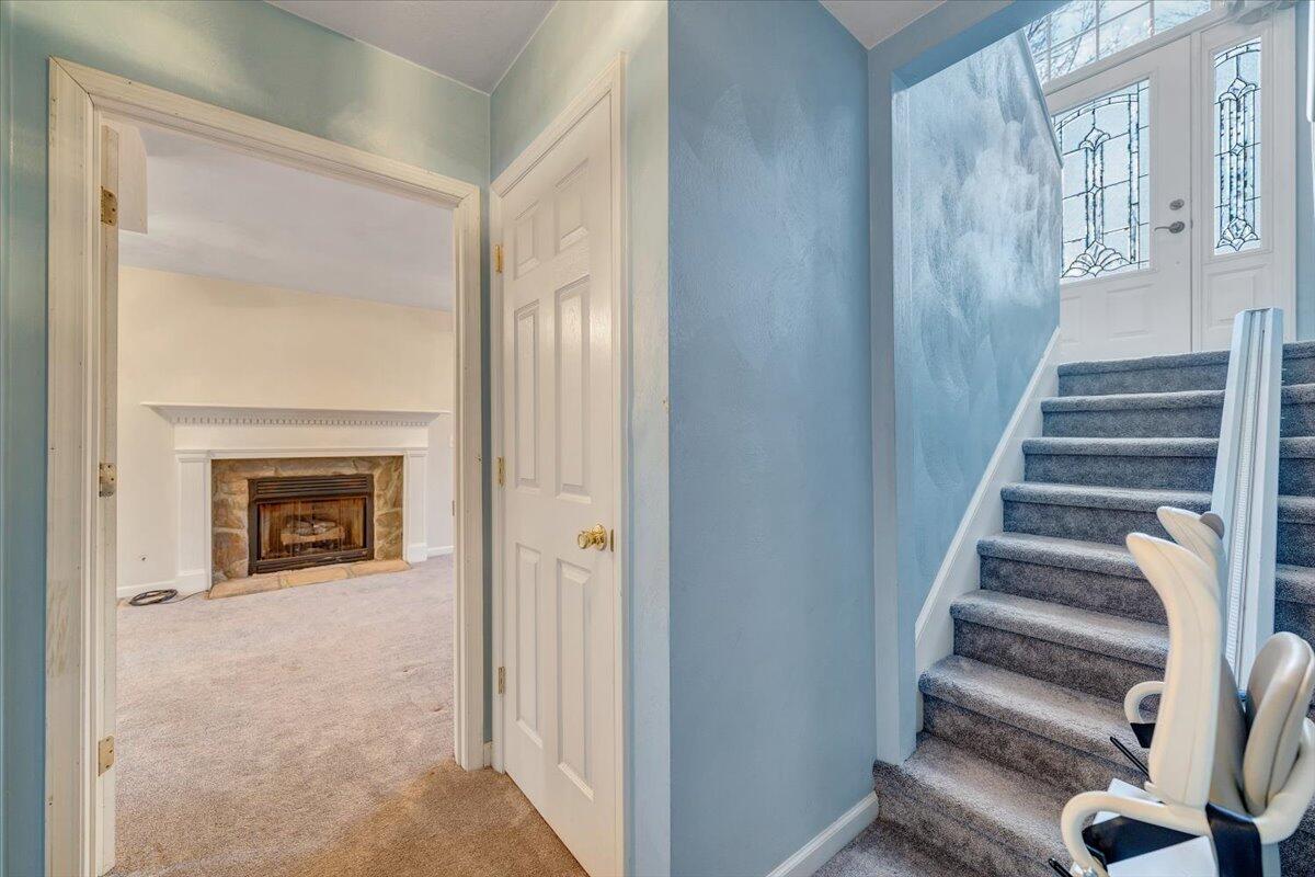 1093 Hales Ford Road Moneta, VA 24121 - Photo 23 of 45 a view of a livingroom with a fireplace stairs and windows