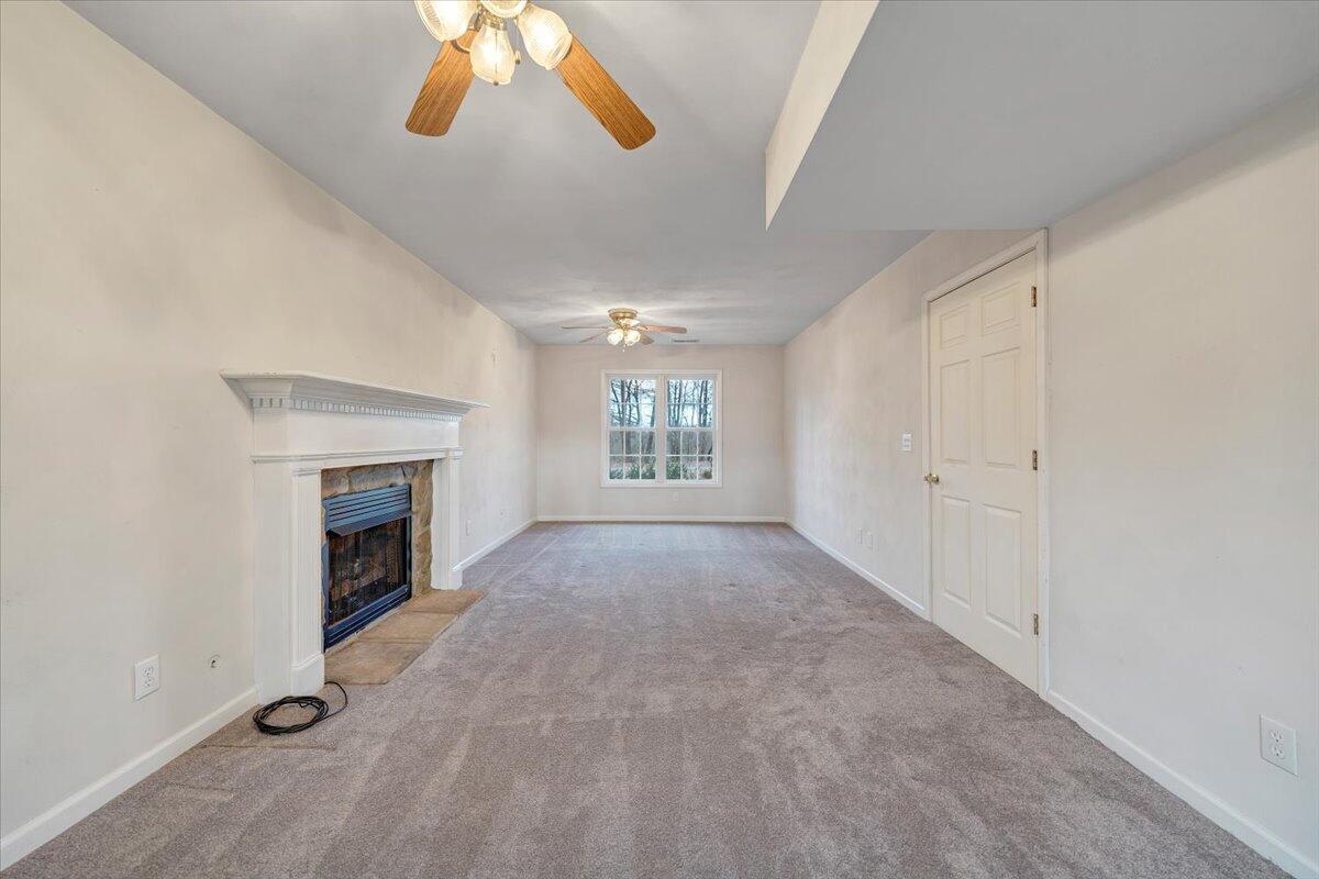 1093 Hales Ford Road Moneta, VA 24121 - Photo 25 of 45 a view of an empty room with a fireplace and a window