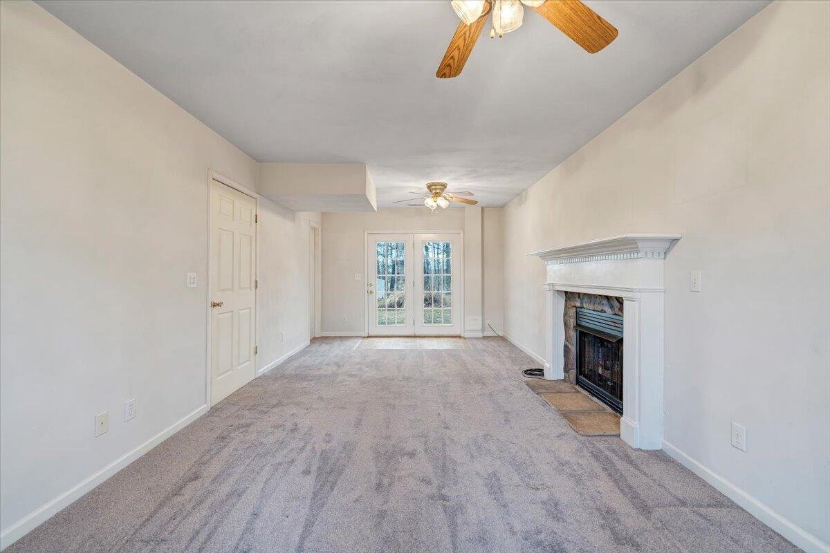 1093 Hales Ford Road Moneta, VA 24121 - Photo 27 of 45 a view of an empty room with window and fireplace