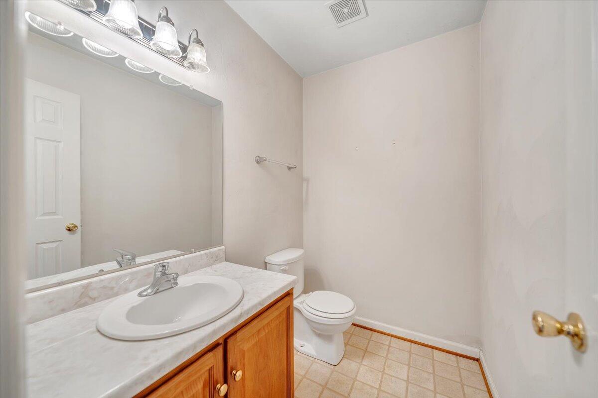 1093 Hales Ford Road Moneta, VA 24121 - Photo 28 of 45 a bathroom with a sink vanity granite and toilet