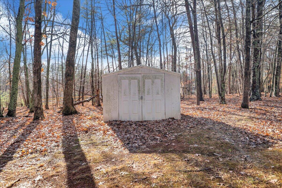 1093 Hales Ford Road Moneta, VA 24121 - Photo 40 of 45 a view of a backyard with large trees