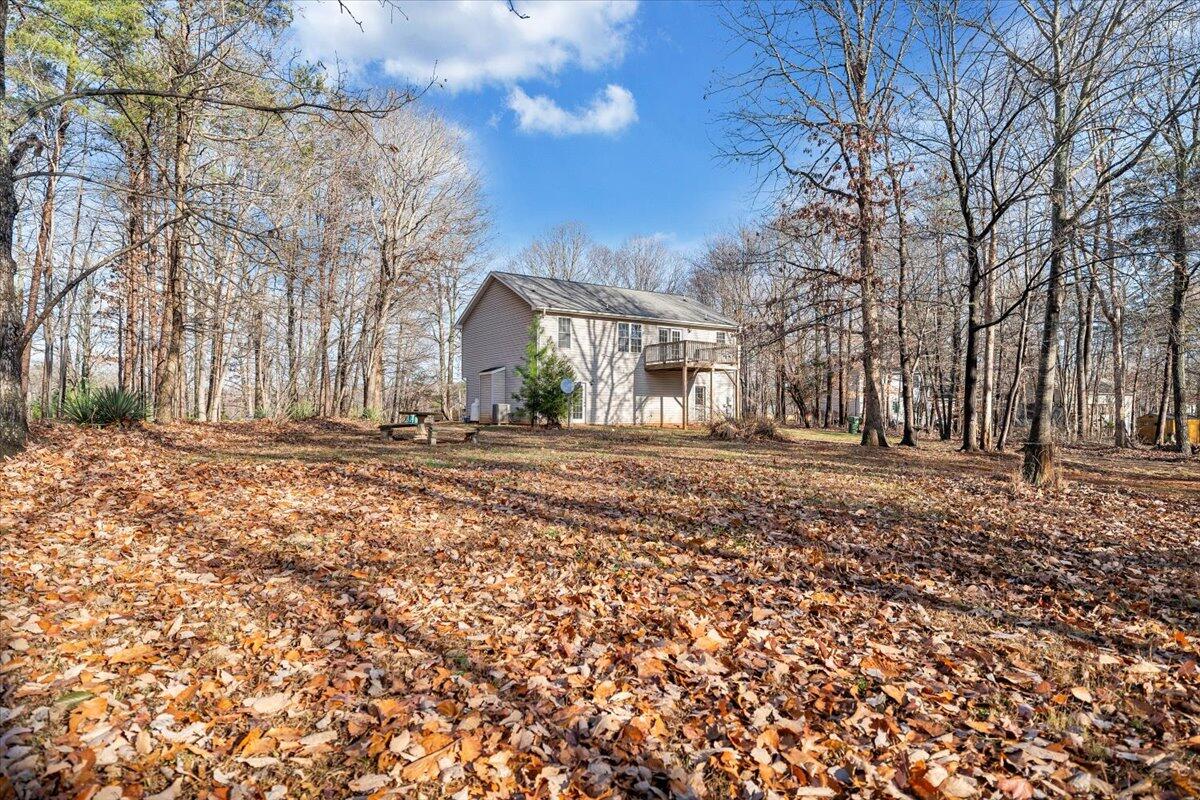 1093 Hales Ford Road Moneta, VA 24121 - Photo 41 of 45 a backyard of a house with large trees