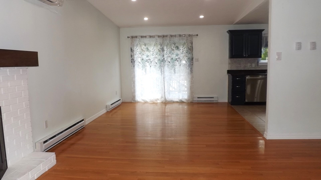 45 Cudworth Road Webster, MA 01570 - Photo 13 of 28 a view of empty room with wooden floor and fan