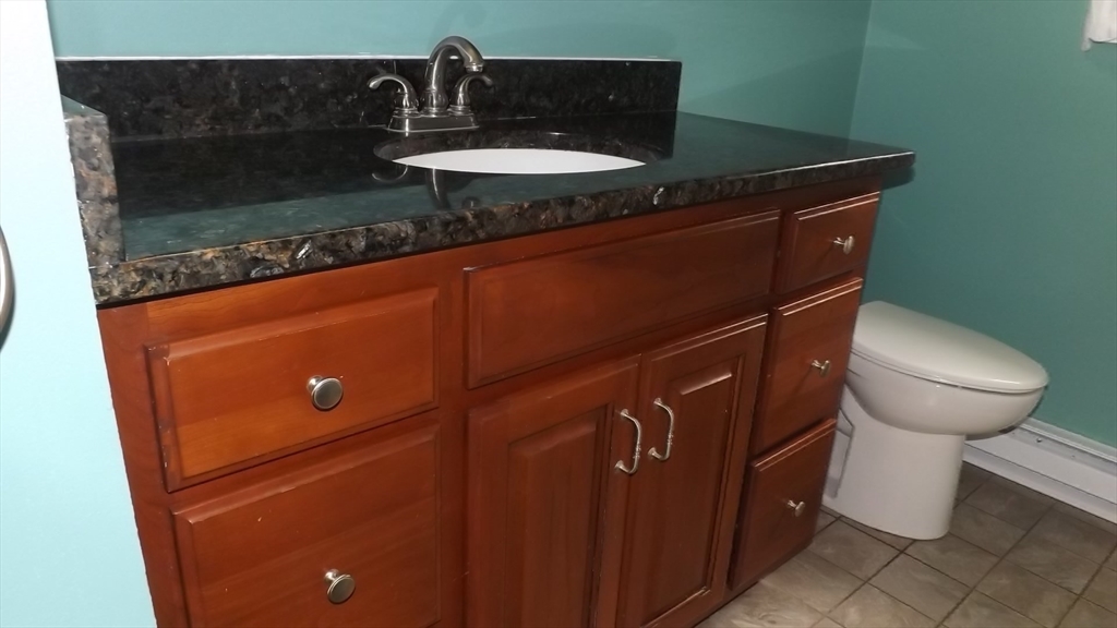45 Cudworth Road Webster, MA 01570 - Photo 18 of 28 a close view of a sink and a stove