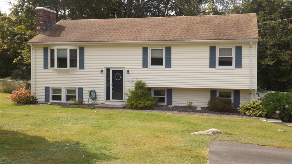 45 Cudworth Road Webster, MA 01570 - Photo 3 of 28 a house that has a lot of windows in it