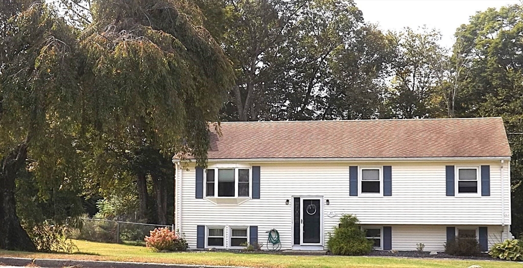 45 Cudworth Road Webster, MA 01570 - Photo 4 of 28 a front view of a residential houses with yard