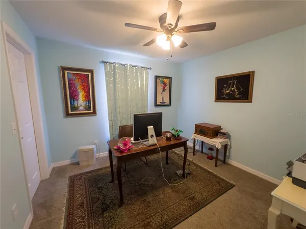 a view of a workspace with furniture