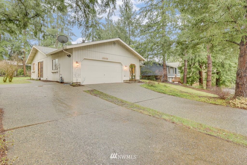 15909 Southeast 178th Street Renton, WA 98058 - Photo 2 of 30 a view of a house with a yard and garage