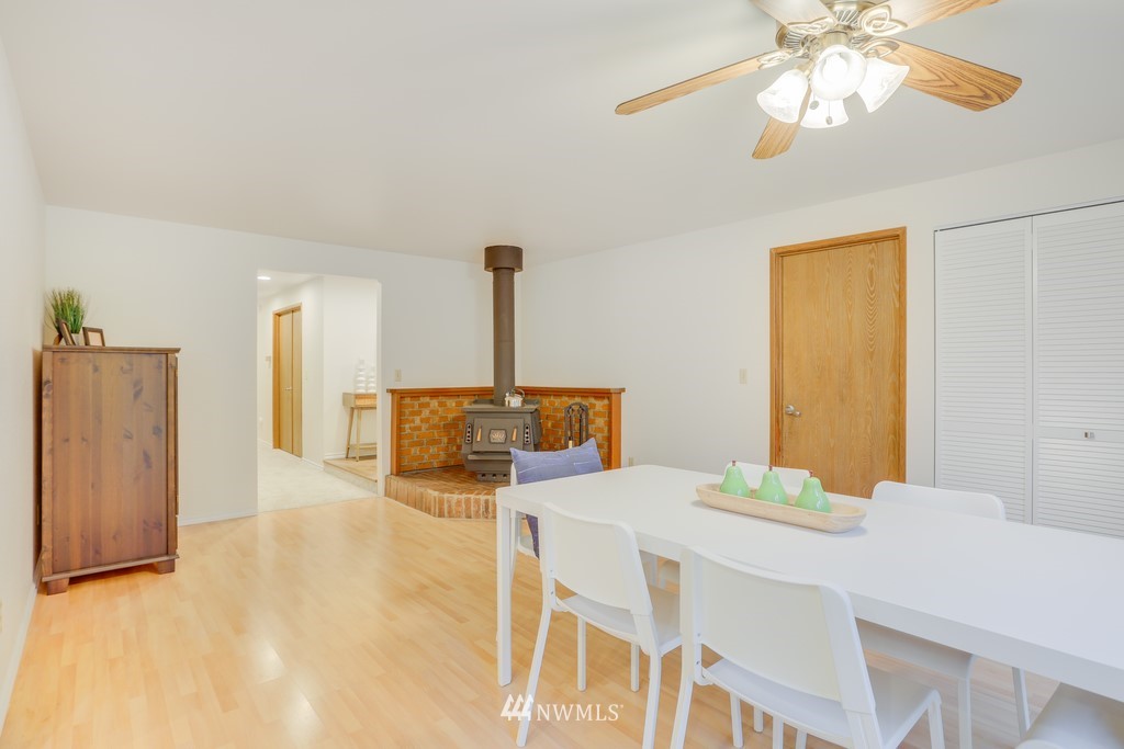 15909 Southeast 178th Street Renton, WA 98058 - Photo 19 of 30 a dining room with furniture and a chandelier