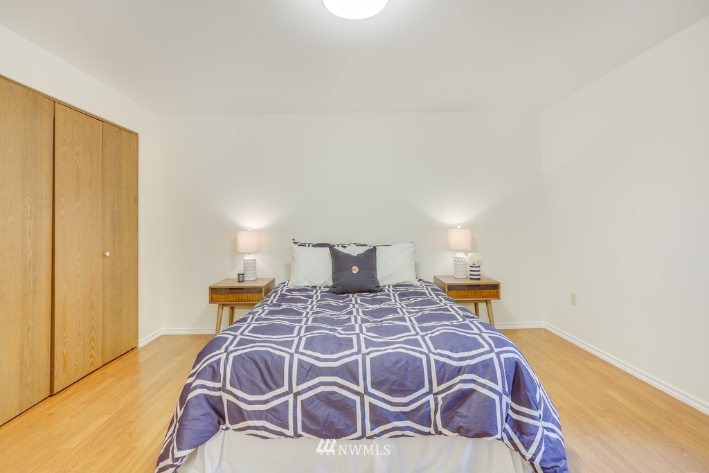 15909 Southeast 178th Street Renton, WA 98058 - Photo 22 of 30 a bedroom with a bed and wooden floor
