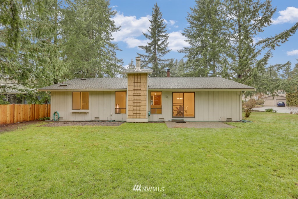 15909 Southeast 178th Street Renton, WA 98058 - Photo 29 of 30 a front view of a house with a garden and tree