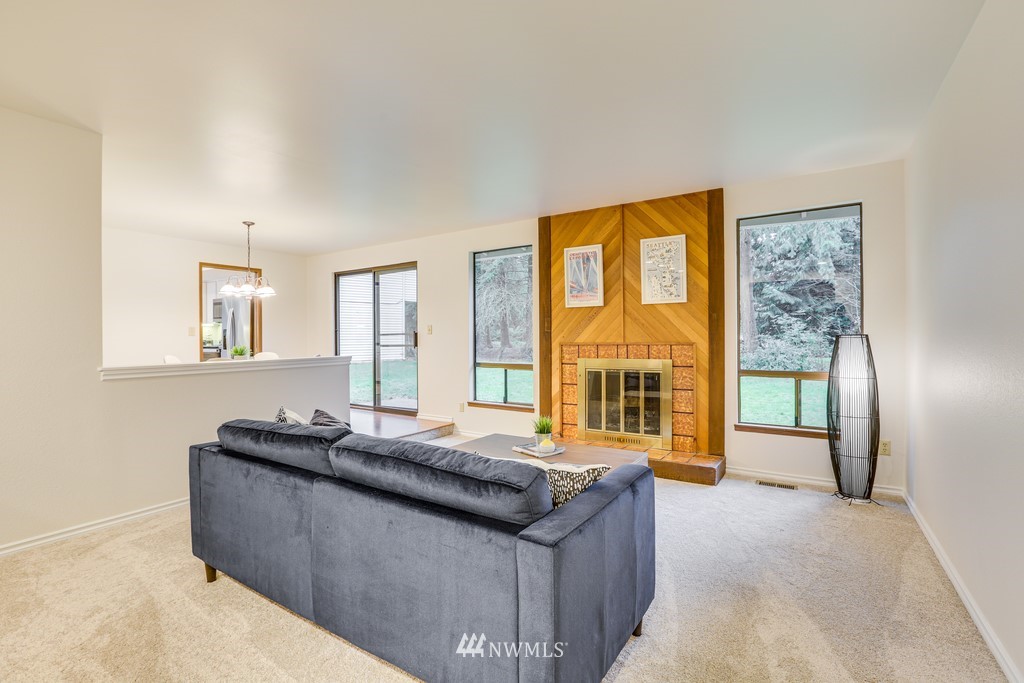 15909 Southeast 178th Street Renton, WA 98058 - Photo 7 of 30 a living room with furniture and large windows