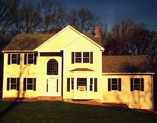 94 Canterbury Road Newtown, CT 06482 - Photo 1 of 1 a front view of a house with a yard