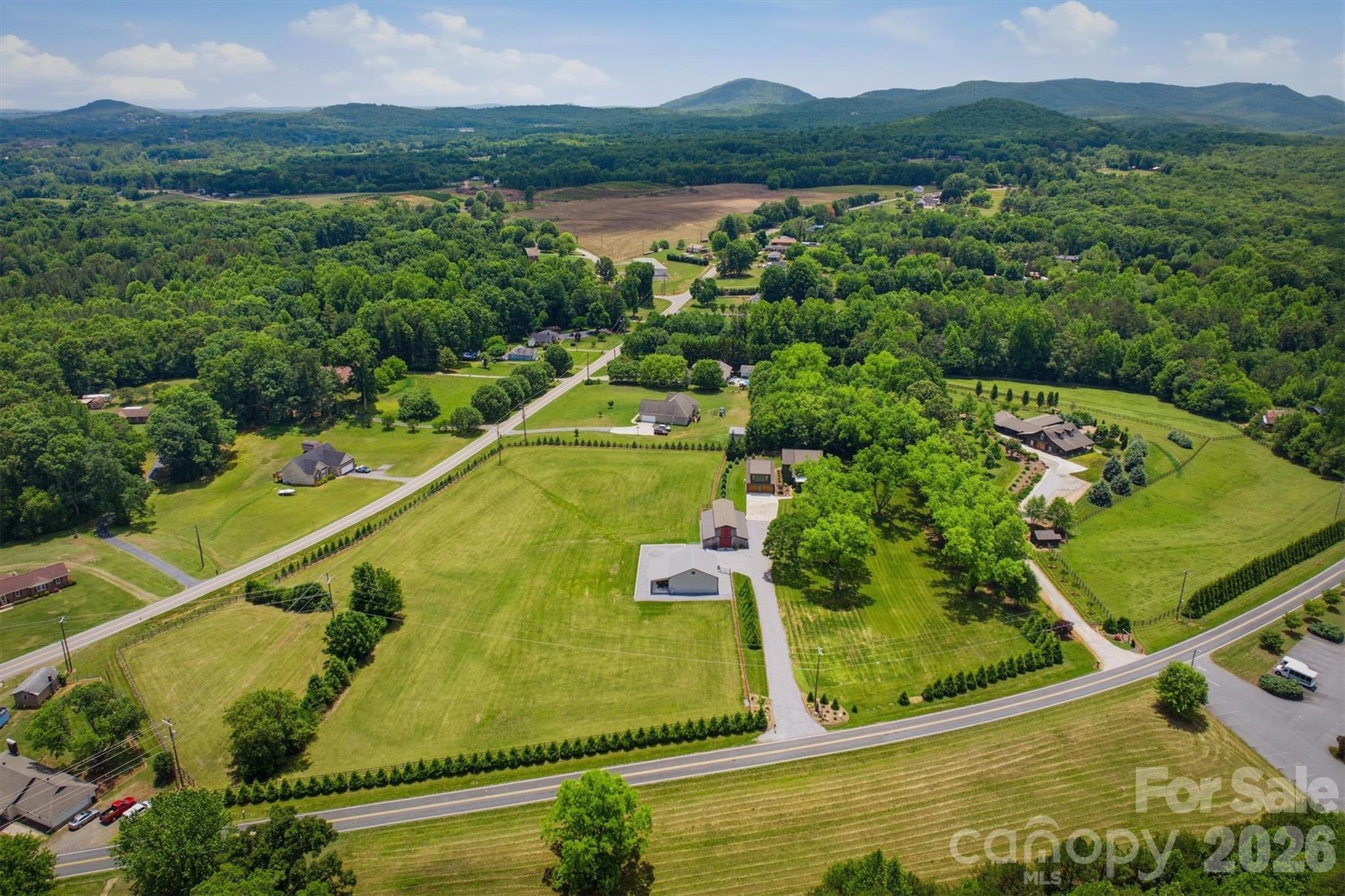 7490 Oak Ridge Church Road Connelly Springs, NC 28612 - Photo 4 of 44 a view of a swimming pool with a lake view