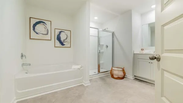 a view of a bathroom with a tub and shower