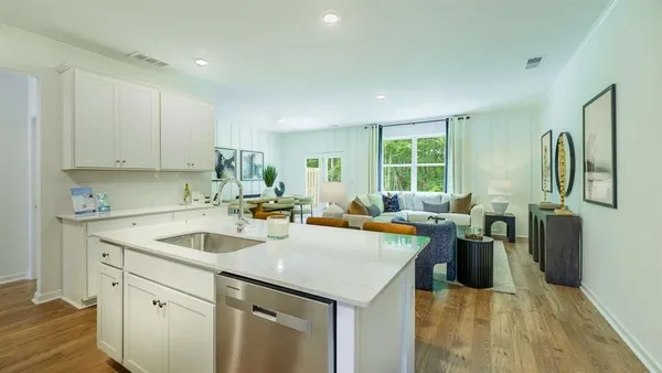 a open kitchen with stainless steel appliances granite countertop a sink a stove and refrigerator