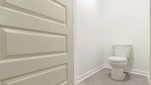 a bathroom with a toilet and a sink